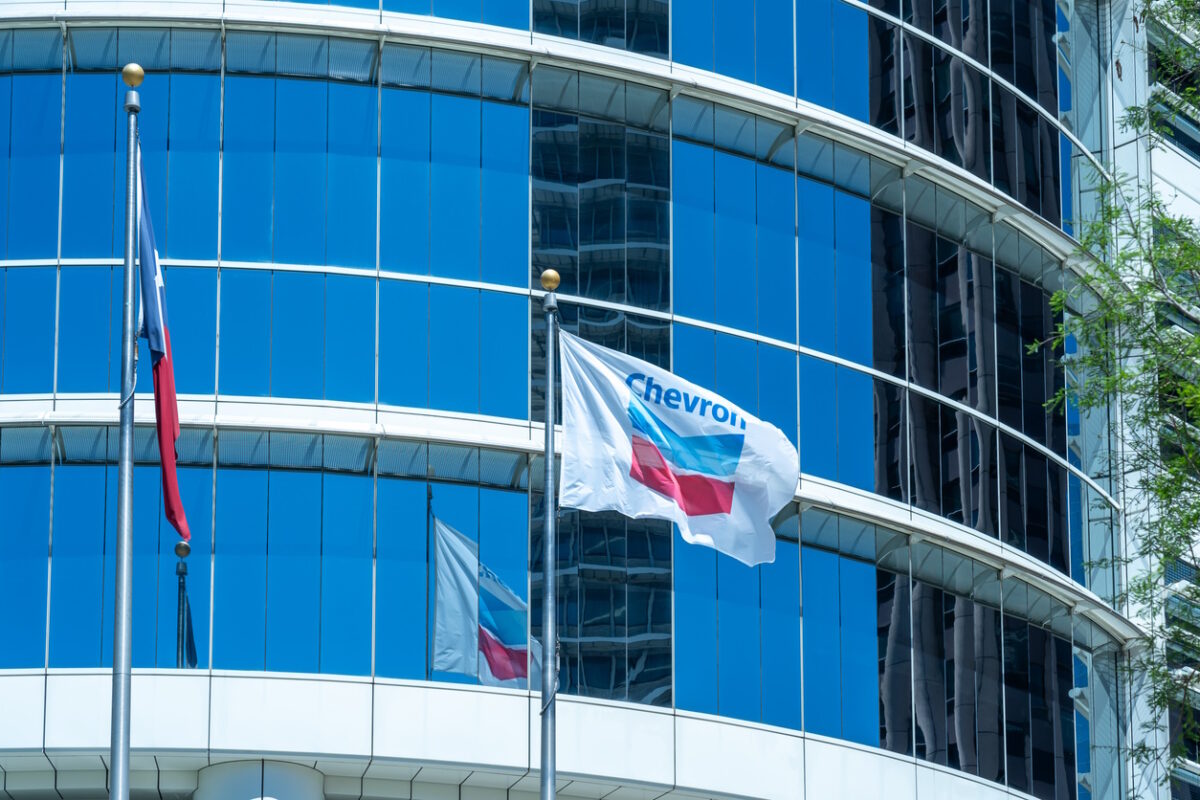 Houston, Texas, USA - April 4, 2024: The flags at Chevron Corporation office building in Houston, Texas, USA. Chevron Corporation is an American multinational energy corporation.