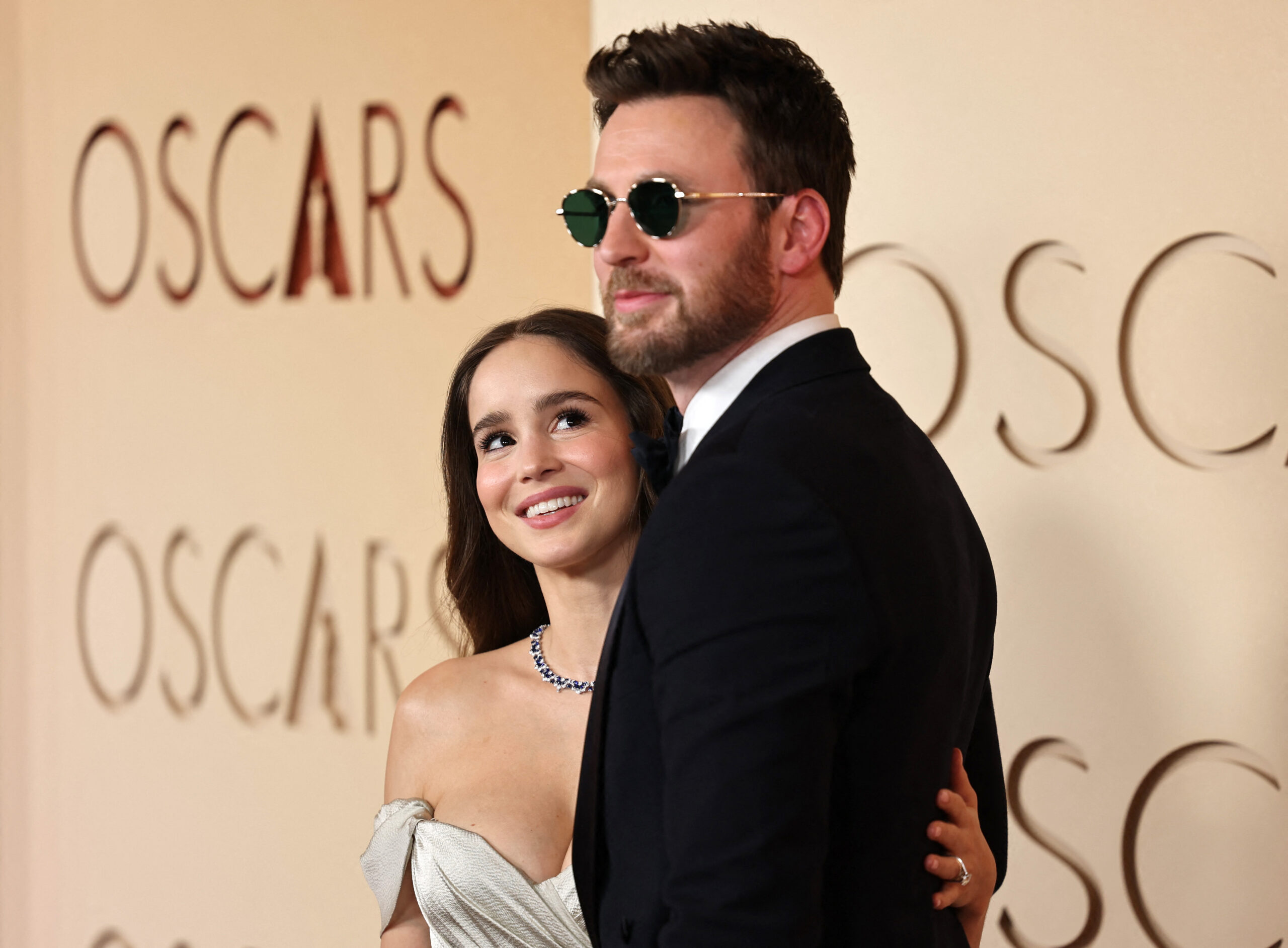 Chris Evans and Alba Baptista pose on the red carpet during the Oscars arrivals at the 98th Academy Awards in Hollywood, Los Angeles, California, U.S., March 15, 2026. REUTERS