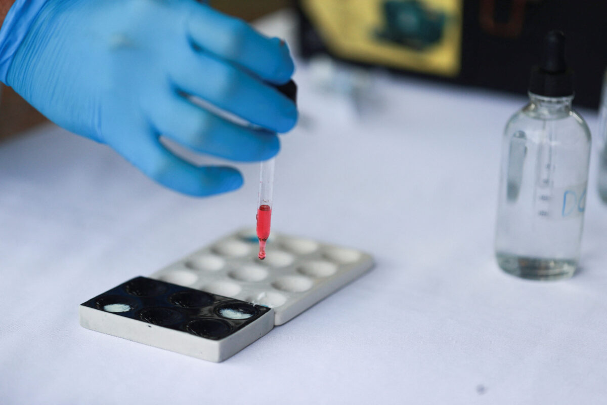 An employee from the bioanalysis unit of the National Institute of Forensic Sciences (INACIF) conducts tests to confirm that packages of seized drugs to be incinerated are narcotics, during an operation carried out by INACIF and the Attorney General’s Office, alongside the U.S. Southern Command, in Pedro Brand, Dominican Republic, February 26, 2026. REUTERS/Erika Santelices.