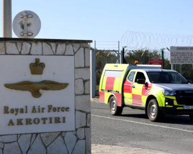 FILE PHOTO: A car drives out of the entrance of RAF Akrotiri, a British sovereign base in the country, as the conflict in the Middle East intensifies, Cyprus March 5, 2026. REUTERS/Yiannis Kourtoglou/File Photo