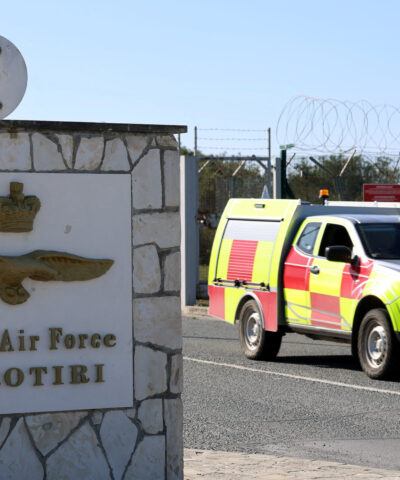 FILE PHOTO: A car drives out of the entrance of RAF Akrotiri, a British sovereign base in the country, as the conflict in the Middle East intensifies, Cyprus March 5, 2026. REUTERS/Yiannis Kourtoglou/File Photo