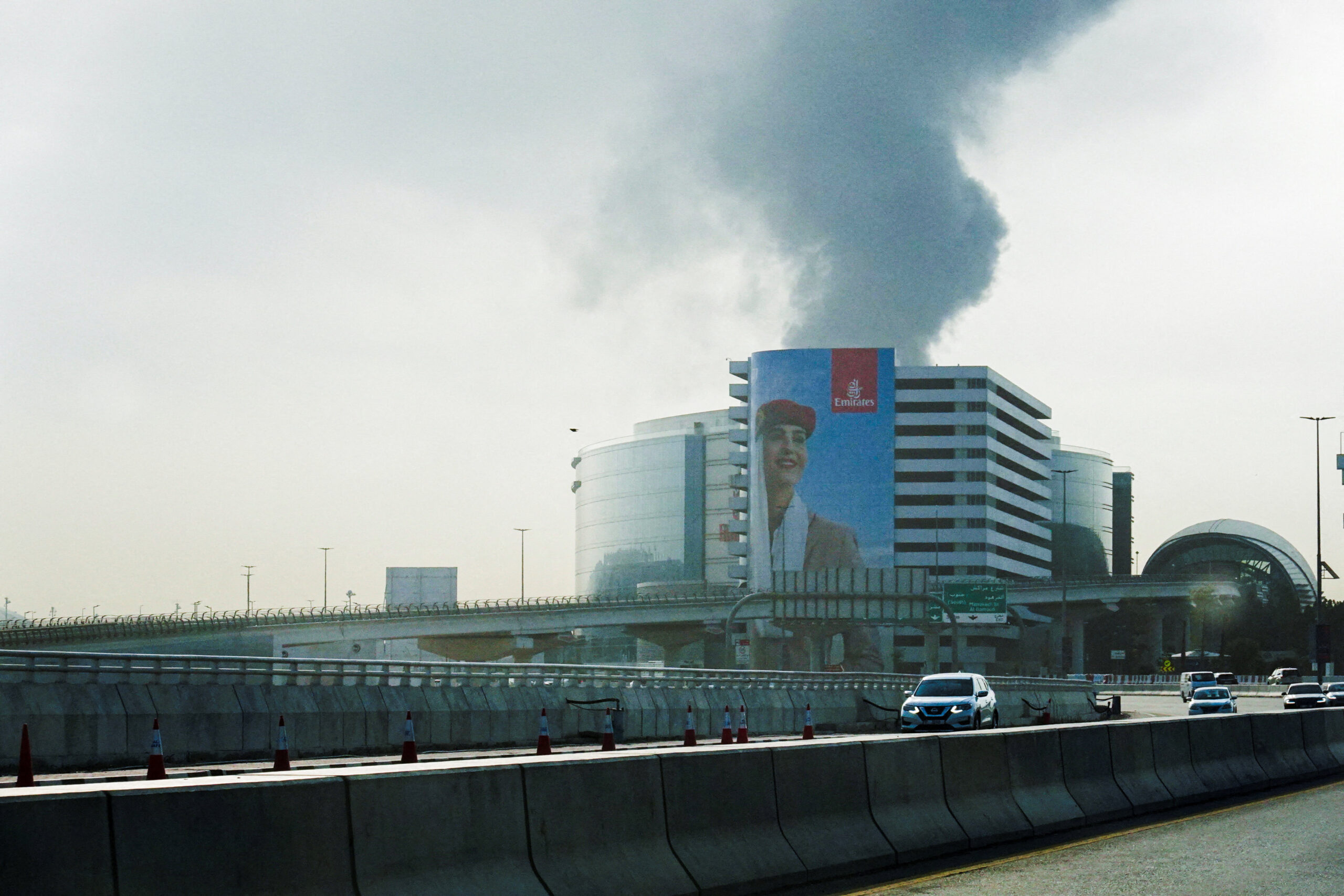 Smoke rises from the Dubai International Airport Smoke rising from the Dubai International Airport is seen through the windshield of a vehicle, after a drone attack hit a fuel tank, according to Dubai authorities, amid the U.S.-Israel conflict with Iran, in Dubai, United Arab Emirates, March 16, 2026, REUTERS/Stringer REFILE - QUALITY REPEAT