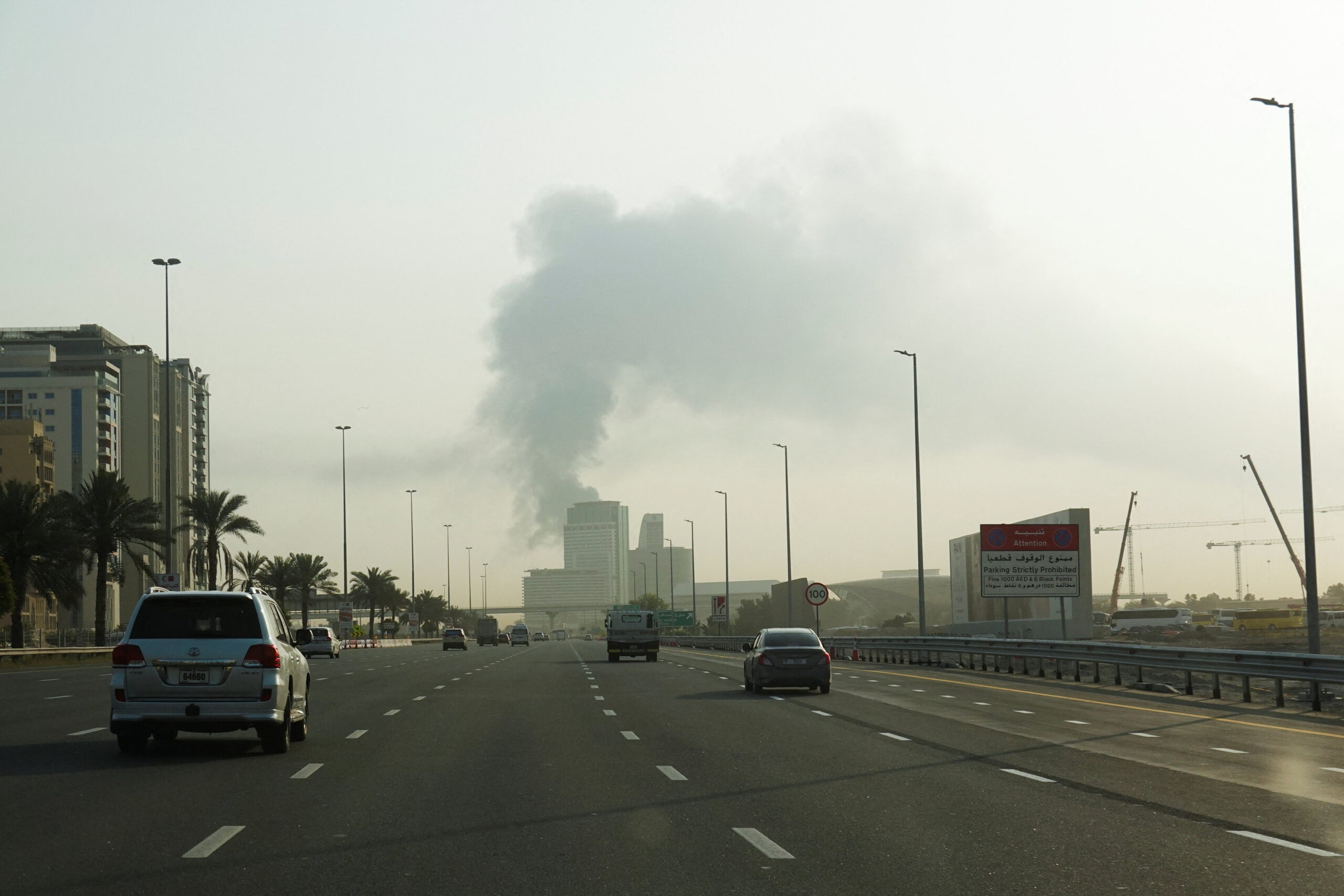 Smoke rises from the Dubai International Airport Smoke rising from the Dubai International Airport is seen through the windshield of a vehicle, after a drone attack hit a fuel tank, according to Dubai authorities, amid the U.S.-Israel conflict with Iran, in Dubai, United Arab Emirates, March 16, 2026, REUTERS/Stringer