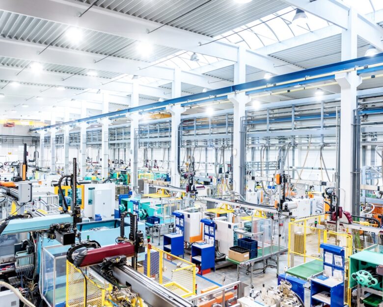 Horizontal color image of large group of modern machines in new factory.