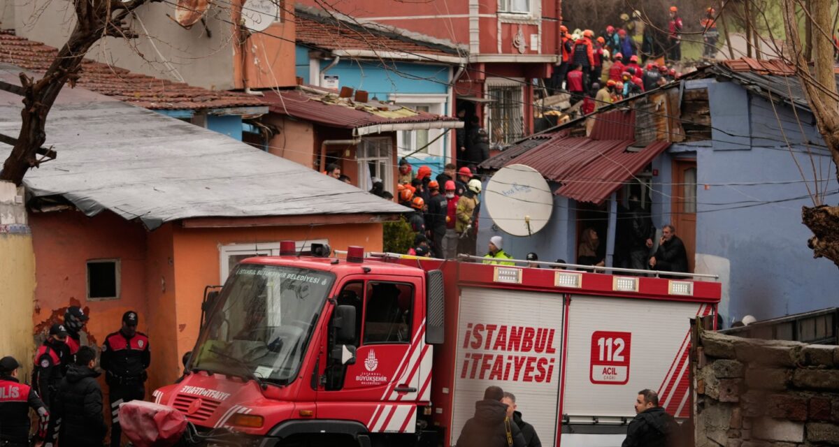 Rescue teams and firefighters search the site where two residential buildings collapsed in Istanbul, Sunday, March 22, 2026. (AP Photo/Khalil Hamra)