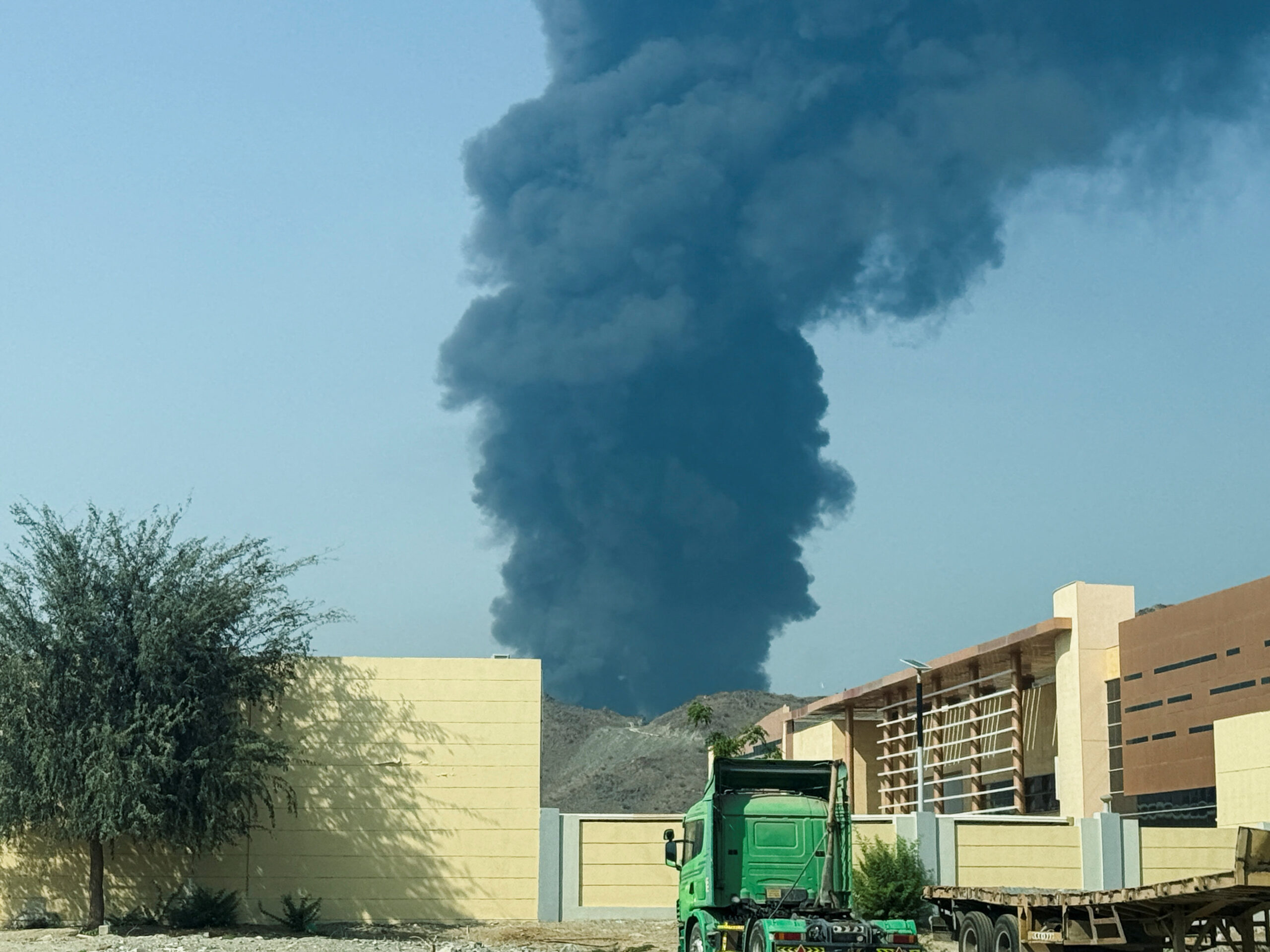Smoke rises in the Fujairah oil industry zone, caused by debris after interception of a drone by air defenses, according to the Fujairah media office, amid the U.S.-Israel conflict with Iran, in Fujairah Smoke rises in the Fujairah oil industry zone, caused by debris after interception of a drone by air defenses, according to the Fujairah media office, amid the U.S.-Israel conflict with Iran, in Fujairah, United Arab Emirates, March 14, 2026. Picture taken with a mobile phone. REUTERS/Staff