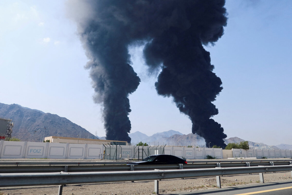 FILE PHOTO: Smoke rises in the Fujairah oil industry zone, caused by debris after interception of a drone by air defenses, according to the Fujairah media office, amid the U.S.-Israel conflict with Iran, in Fujairah, United Arab Emirates, March 14, 2026. REUTERS/Staff/File Photo