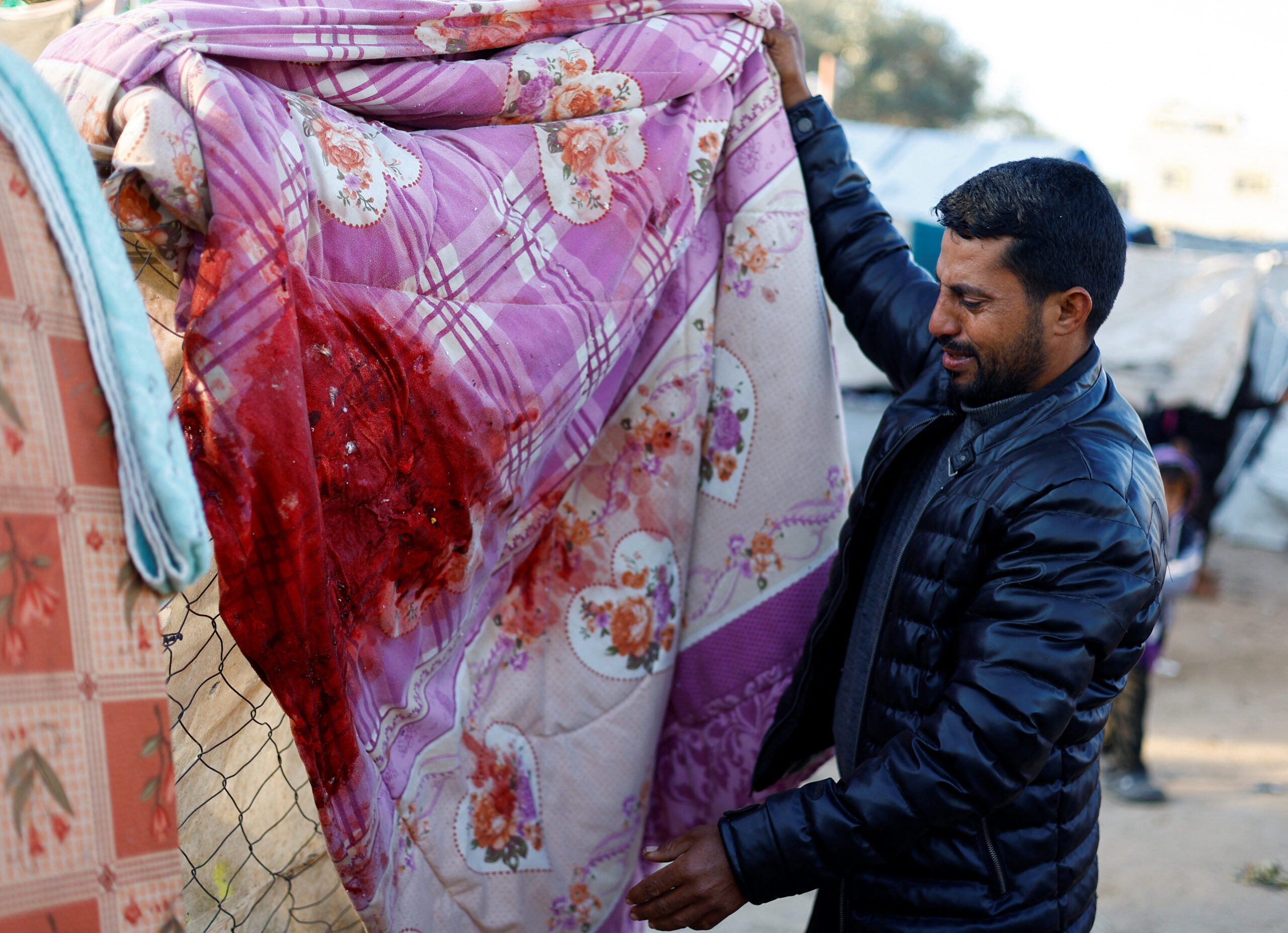 A relative of Palestinians killed in an Israeli strike on a tent sheltering displaced people, reacts at the site of the strike in Nuseirat, central Gaza Strip March 9, 2026. REUTERS/Mahmoud Issa