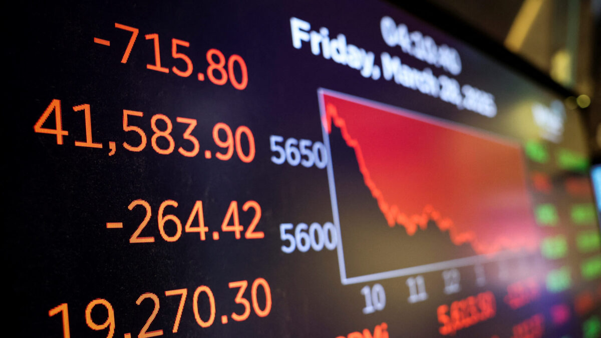 A screen displays the Dow Jones Industrial Average after the closing bell on the floor at the New York Stock Exchange (NYSE) in New York City, U.S., March 28, 2025. REUTERS/Jeenah Moon
