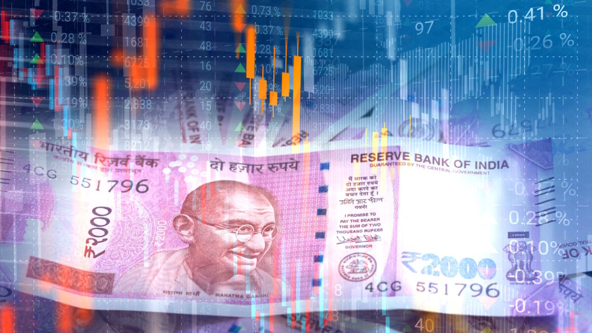 Indian Rupee paper currency on virtual interface of stock market data