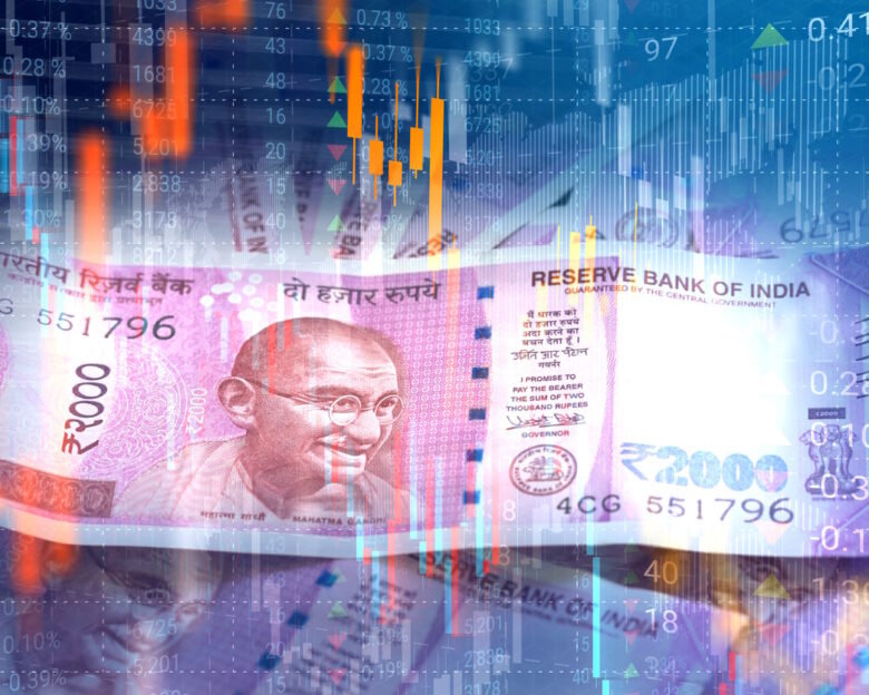 Indian Rupee paper currency on virtual interface of stock market data