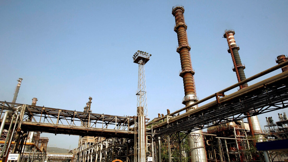FILE PHOTO: FILE PHOTO: A worker rides a bicycle at the Bharat Petroleum Corporation Ltd. refinery in Mumbai April 24, 2008. REUTERS/Punit Paranjpe/File Photo/File Photo/File Photo