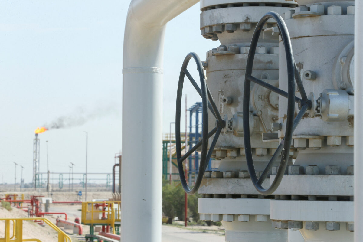 A gas flare burns in the distance at the Rumaila oil field, amid nationwide output cuts following the closure of the Strait of Hormuz, in Basra, Iraq, March 4, 2026. REUTERS/Essam Al-Sudani