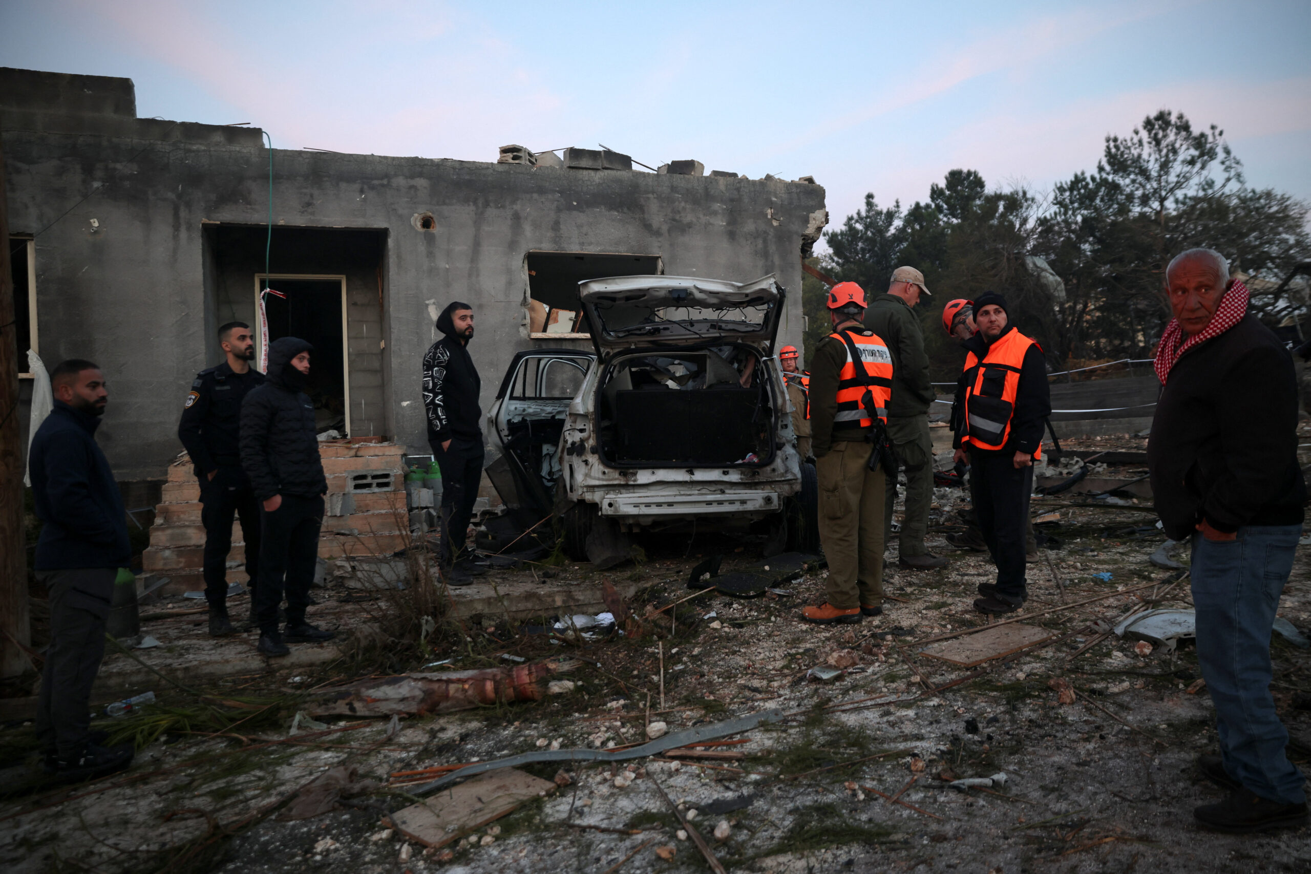Aftermath of an Iranian missile strike, amid the U.S.-Israeli conflict with Iran, in northern Israel Israeli emergency responders and people gather at the site of an impact by an Iranian missile, amid the U.S.-Israel conflict with Iran, in northern Israel, March 13, 2026. REUTERS/Shir Torem