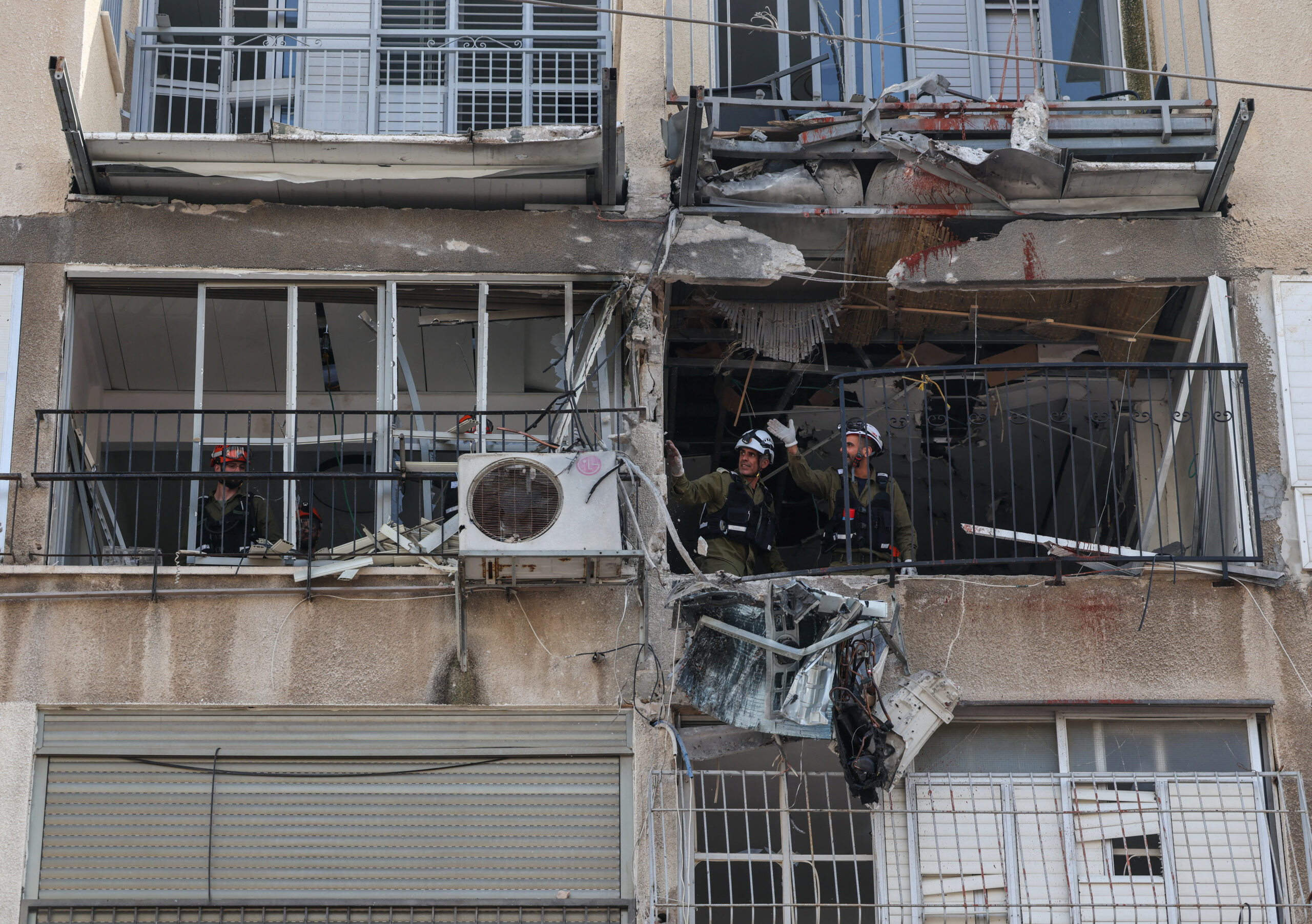 Aftermath of an Iranian projectile strike in central Israel Emergency personnel work inside a damaged building following an Iranian projectile strike, amid the U.S.-Israeli conflict with Iran, in central Israel, March 15, 2026. REUTERS/Tyrone Siu