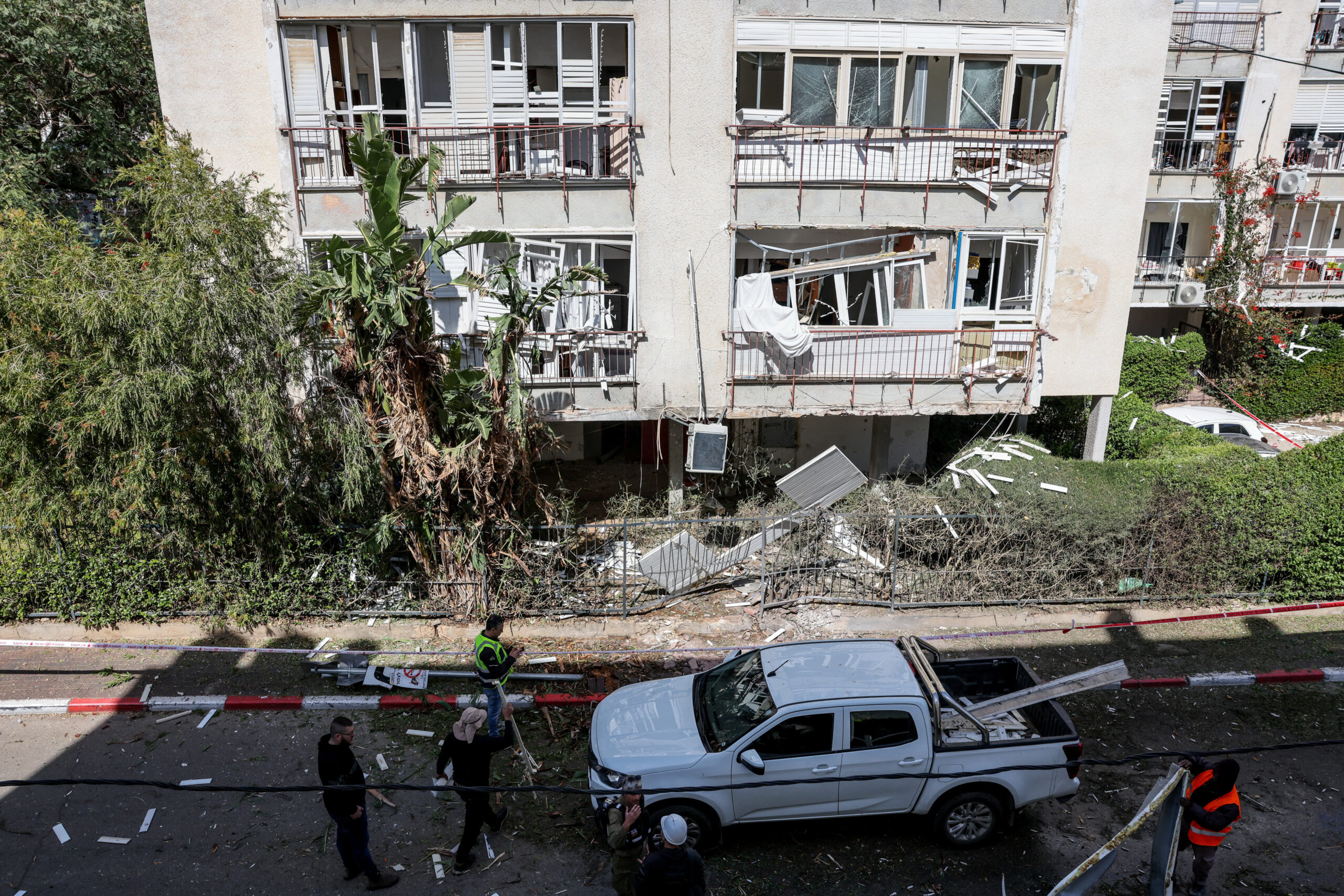 Israeli security and rescue personnel inspect the damage at the scene following a missile attack by Iran, amid the U.S.-Israeli conflict with Iran, in Givatayim A damaged building at the scene following a missile attack by Iran, amid the U.S.-Israeli conflict with Iran, in Givatayim near Tel Aviv, Israel March 6, 2026. REUTERS/Nir Elias
