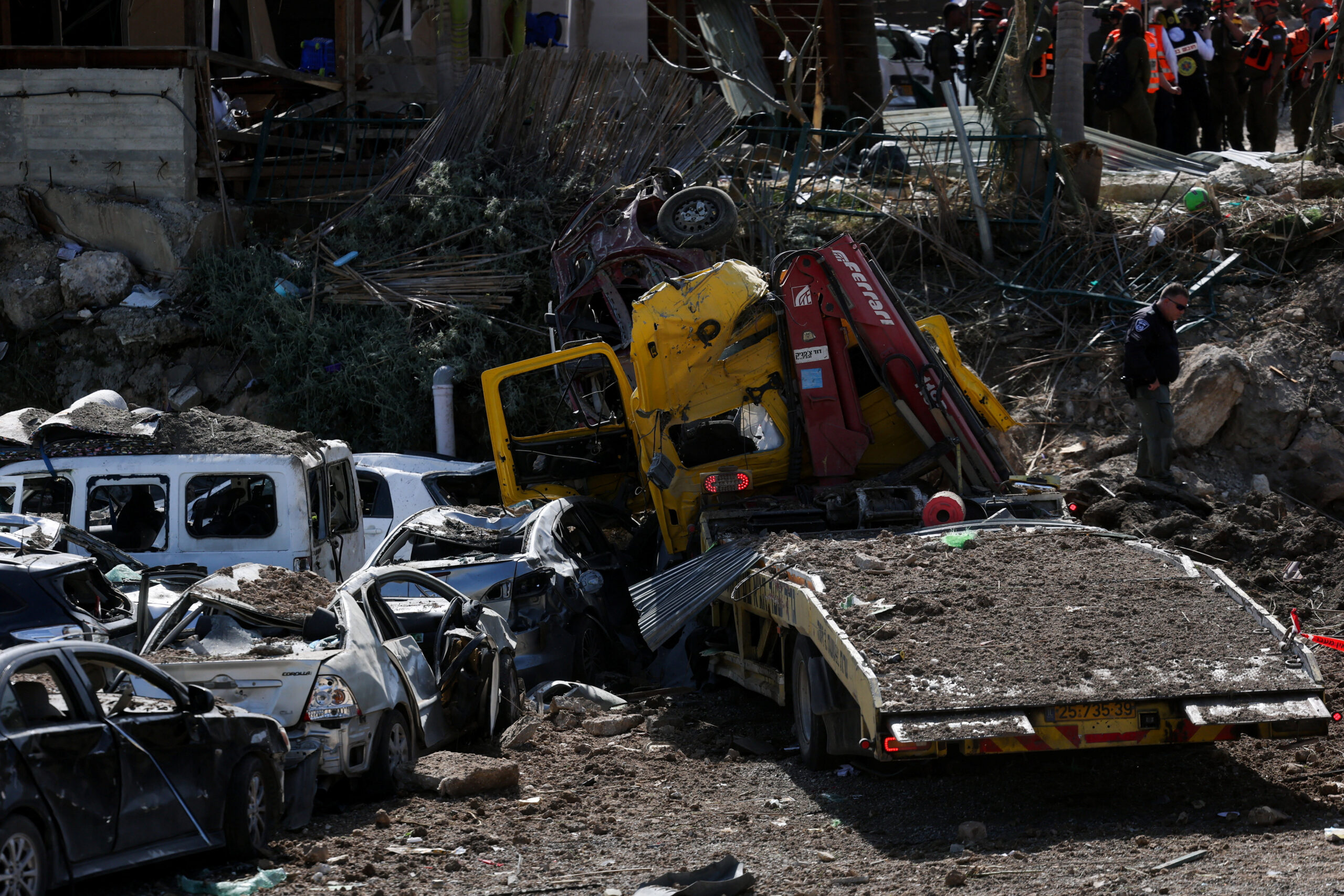 The impact site following Iranian missile barrages as the U.S.-Israeli conflict with Iran continues, in central Israel Israeli security and rescue personnel work at the impact site following Iranian missile barrages as the U.S.-Israeli conflict with Iran continues, in central Israel, March 28, 2026. REUTERS/Ammar Awad