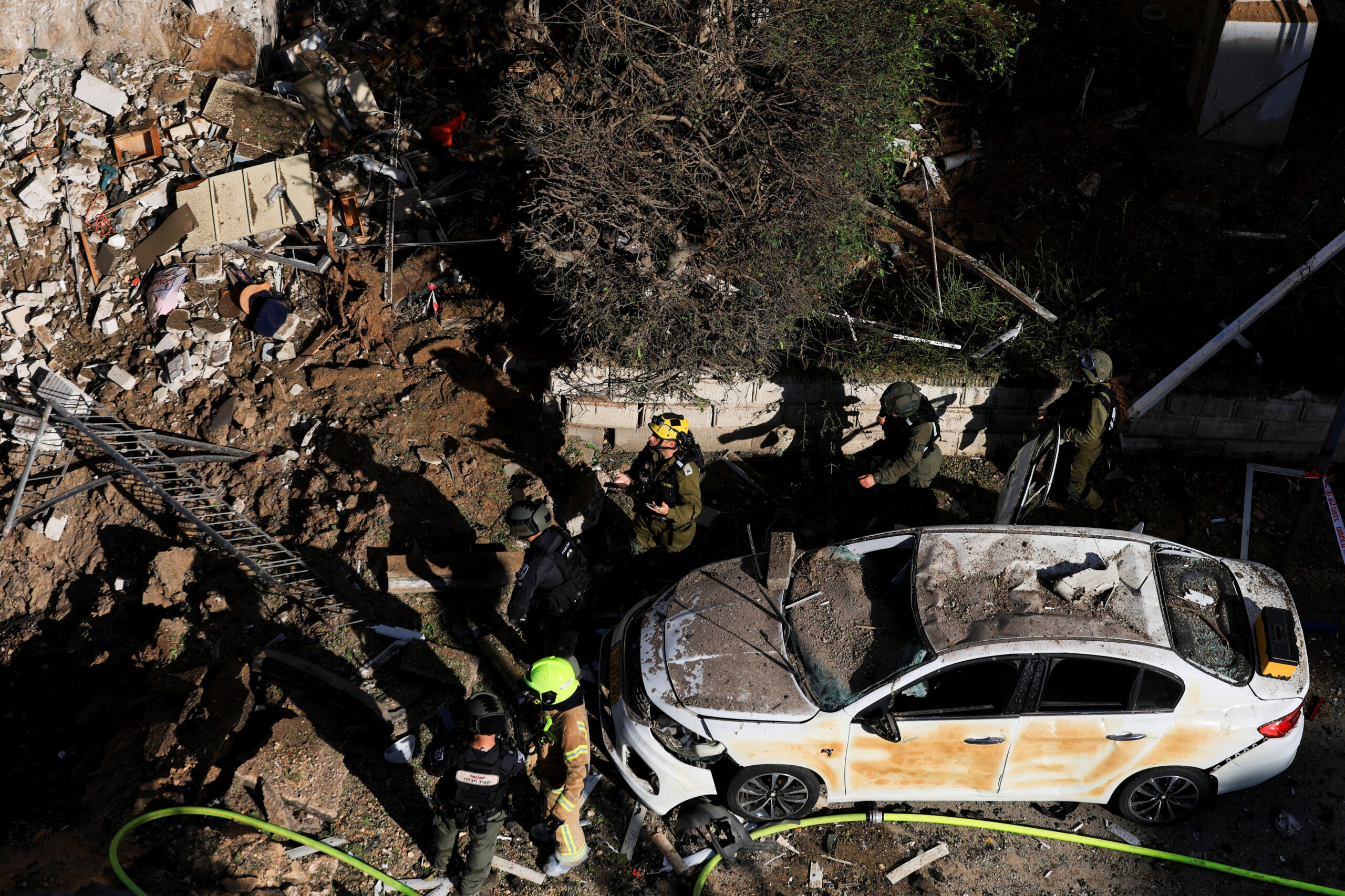 Aftermath of Iranian missile barrages in central Israel Emergency personnel work at the site following Iranian missile barrages in central Israel, amid the U.S.-Israel conflict with Iran, in Tel Aviv, Israel, March 24, 2026. REUTERS/Ronen Zvulun