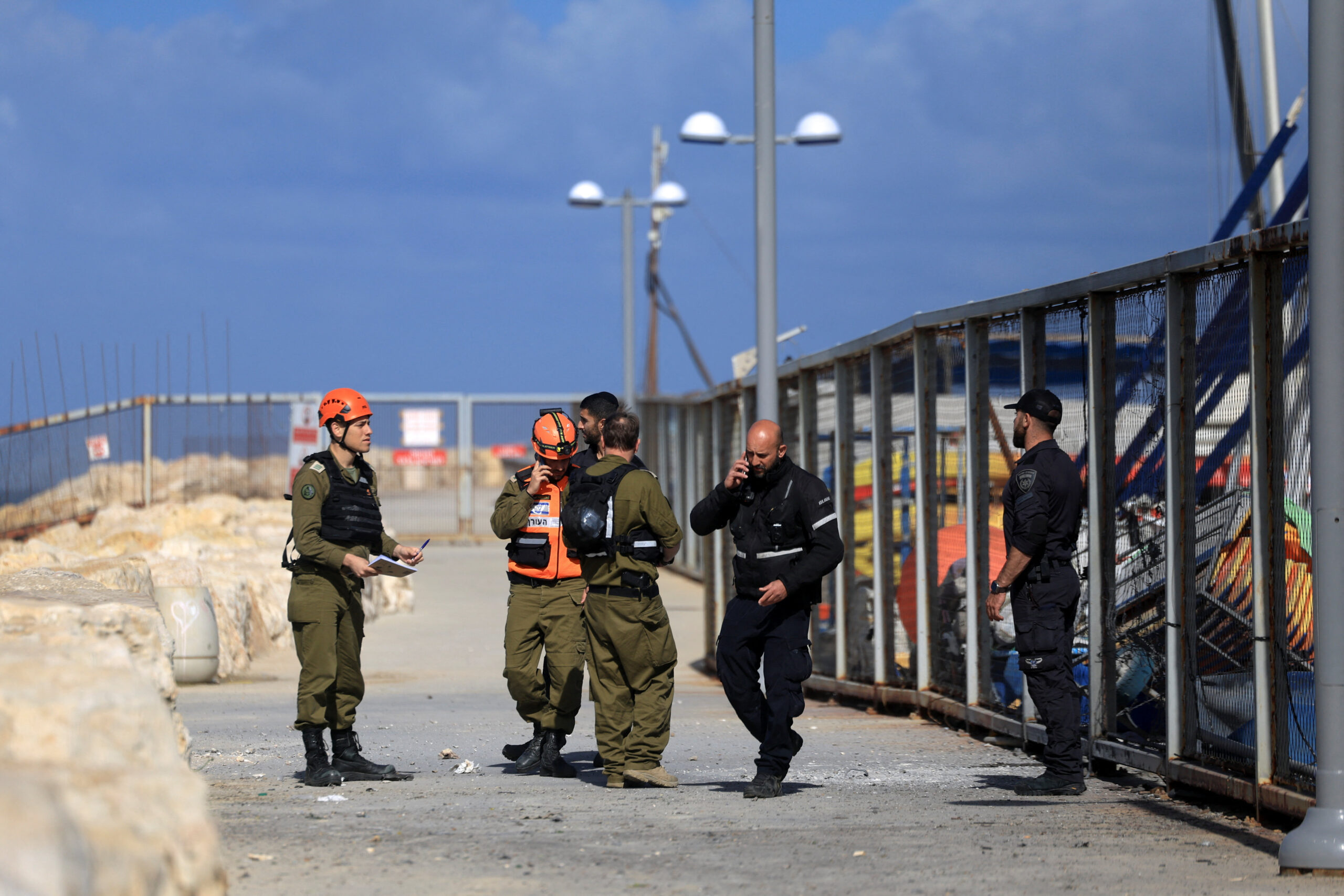 Aftermath of Iranian missile barrages in central Israel Emergency personnel work at the site where damage was caused following the launch of barrages of Iranian missiles towards Israel, amid the U.S.-Israeli conflict with Iran, in central Israel, March 31, 2026. REUTERS/Ronen Zvulun