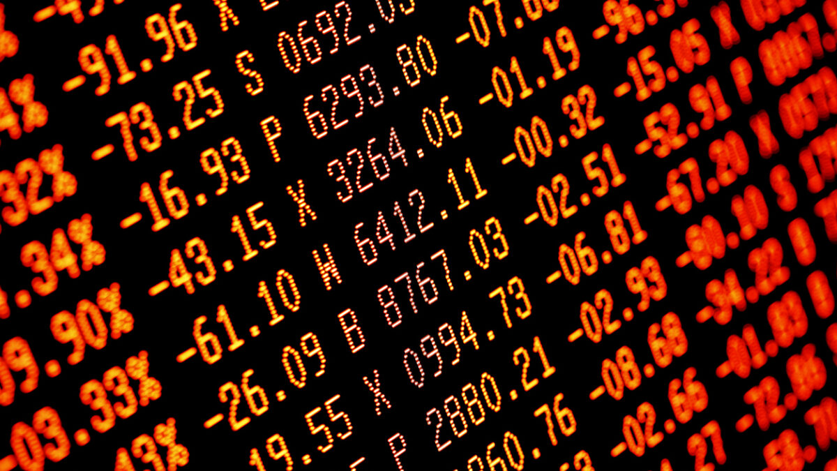 Trading screen financial data in red. Sell-off. Selective focus. Focus is appx central. Heavy selling.