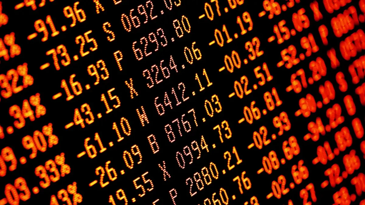 Trading screen financial data in red. Sell-off. Selective focus. Focus is appx central. Heavy selling.