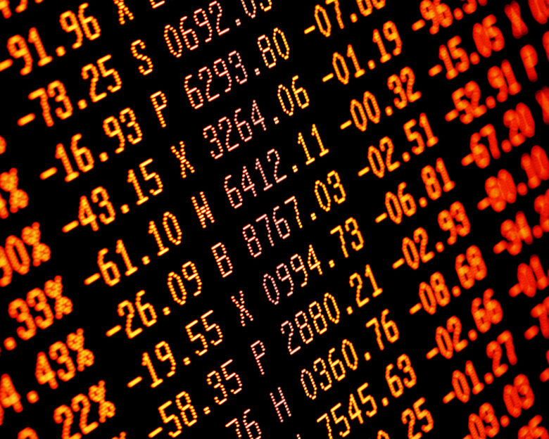 Trading screen financial data in red. Sell-off. Selective focus. Focus is appx central. Heavy selling.