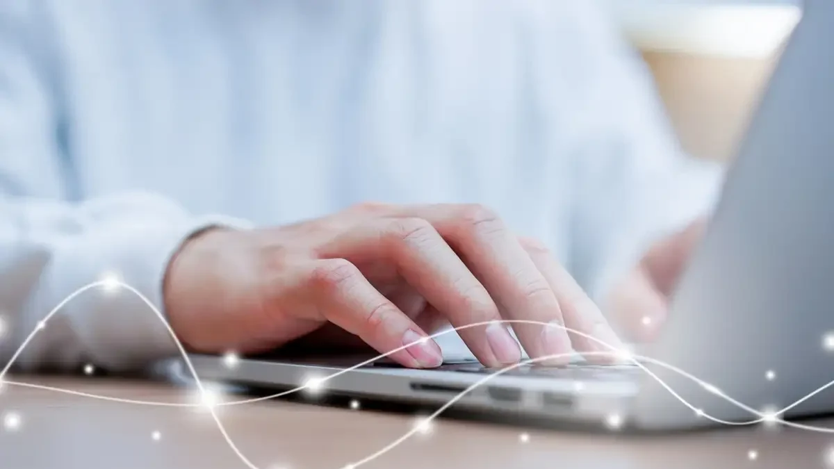 Laptop close up network man typing on keyboard laptop to access internet with virtual interface fiber optical telecommunication to exchange data information in the cyber network for business and futuristic technology communication concept