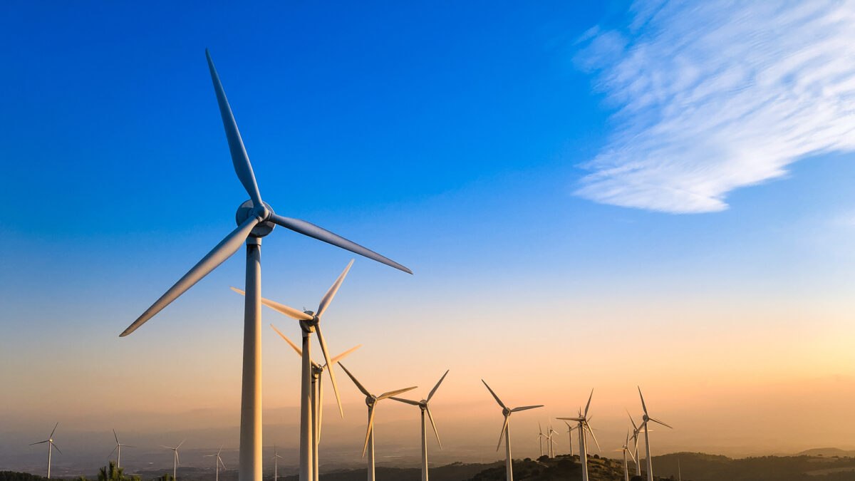 Wind farm in Navarre, Spain at sunset. Renewable energy concept.