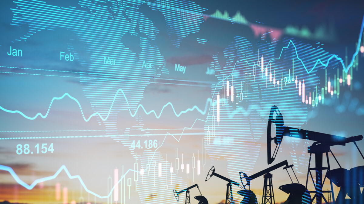 Rise in gasoline prices concept with double exposure of digital screen with financial chart graphs and oil pumps on a field
