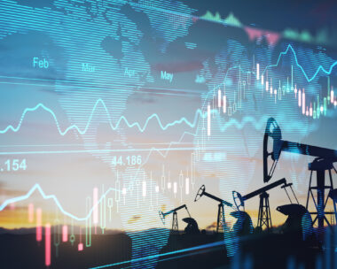 Rise in gasoline prices concept with double exposure of digital screen with financial chart graphs and oil pumps on a field