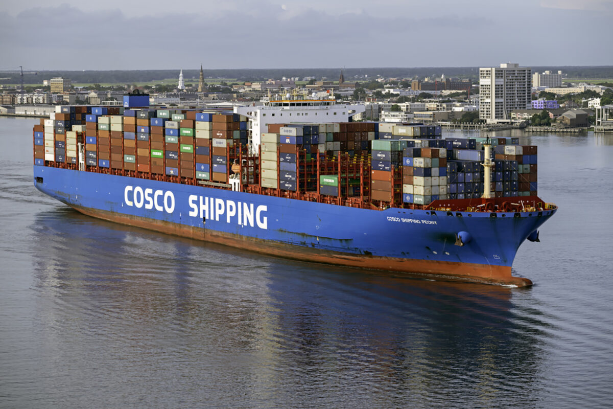 Charleston, SC, USA - August 25, 2021: Peony, a 366-meter container vessel owned by COSCO Shipping and flagged to Hong Kong, sails into Charleston Harbor.