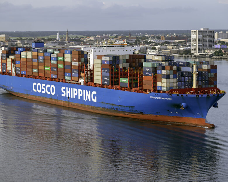 Charleston, SC, USA - August 25, 2021: Peony, a 366-meter container vessel owned by COSCO Shipping and flagged to Hong Kong, sails into Charleston Harbor.