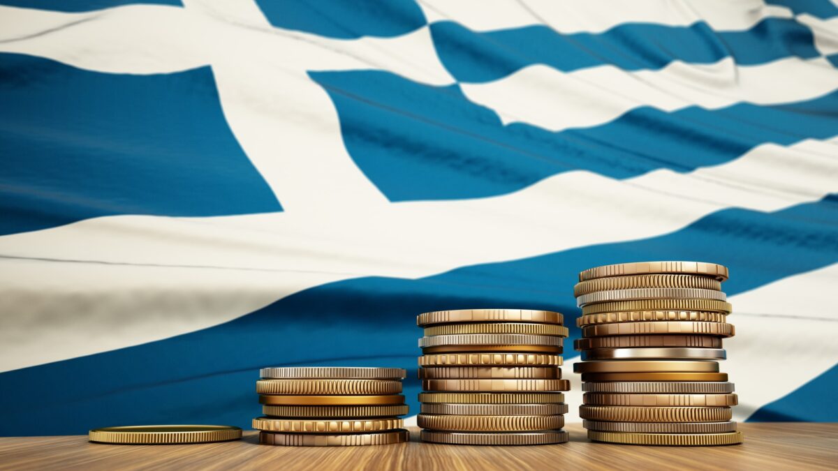 Rising stack of coins with Greek flag in the background