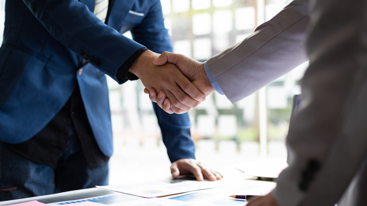 Business partner handshake after the meeting. Financial and investment cooperation.