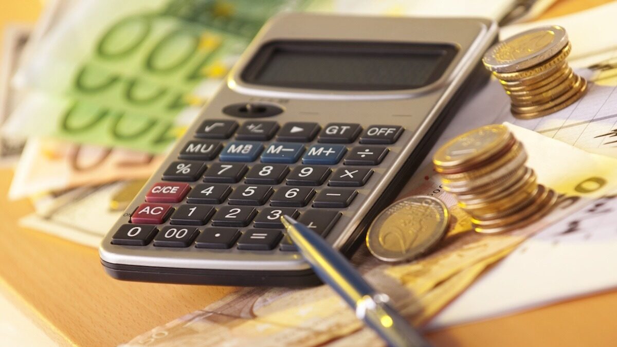 European money on a table with calculator and coins, money and banking concept