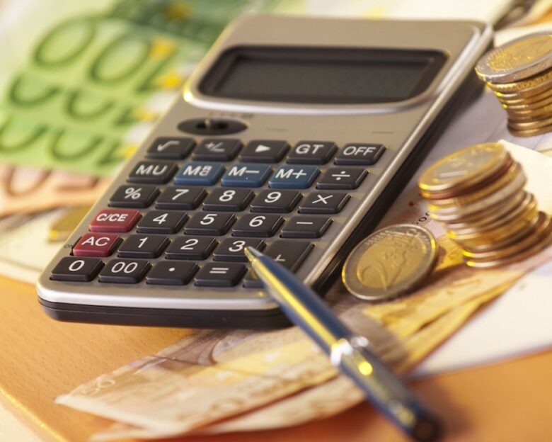 European money on a table with calculator and coins, money and banking concept