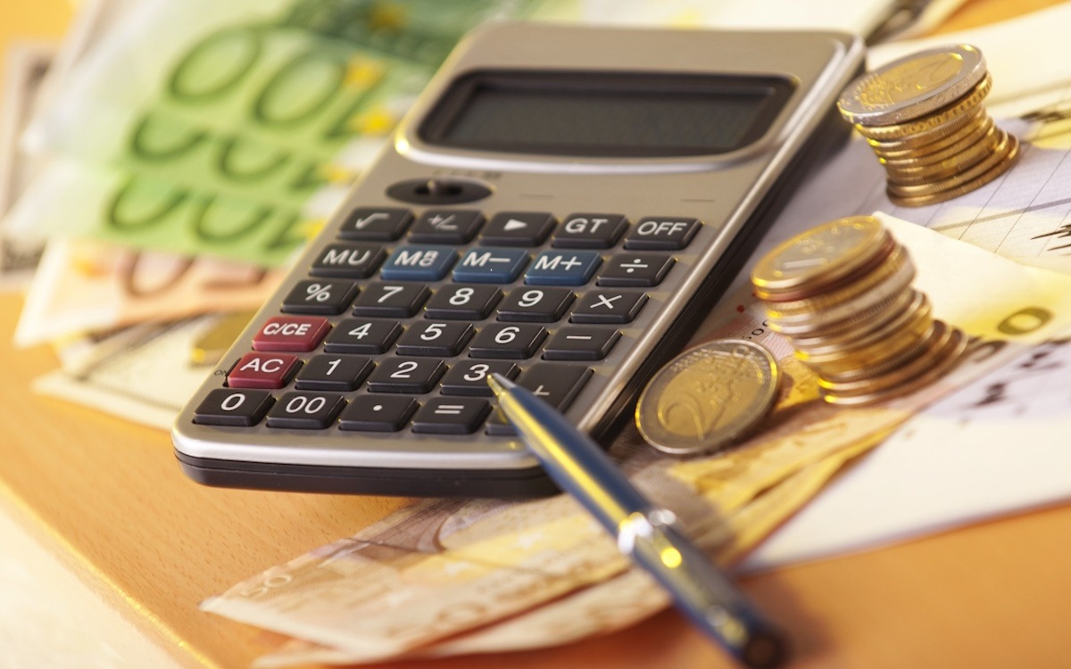 European money on a table with calculator and coins, money and banking concept