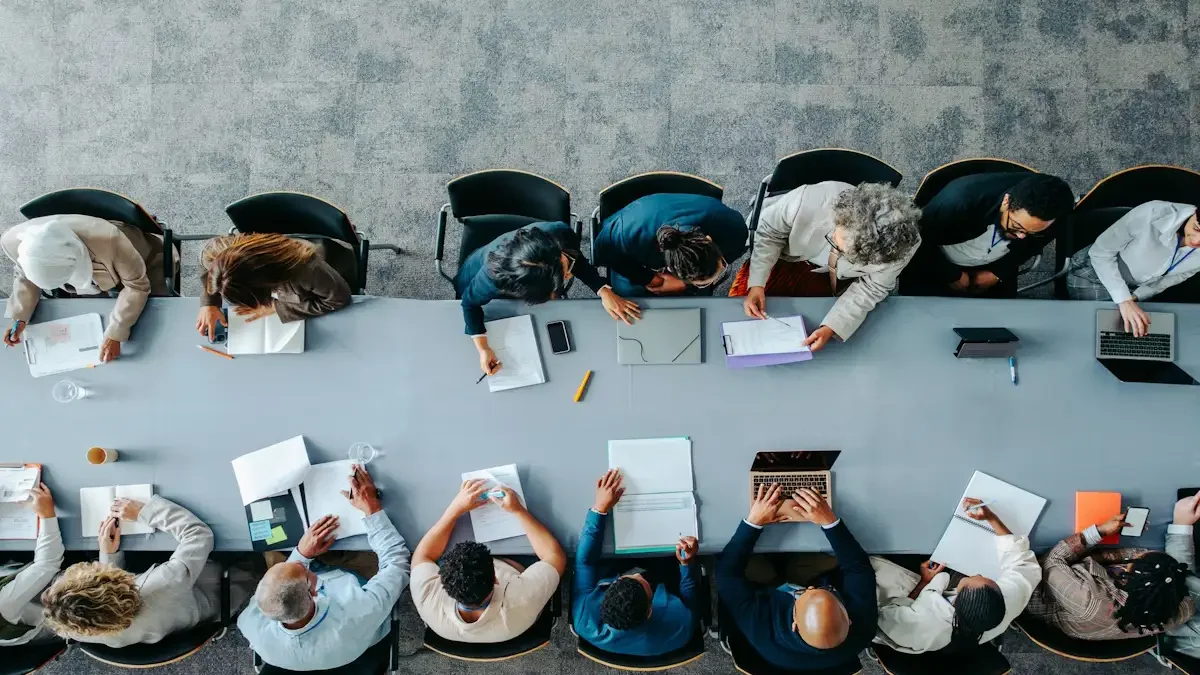 Top view of diverse business group in office meeting, collaborating and discussing around a large table.