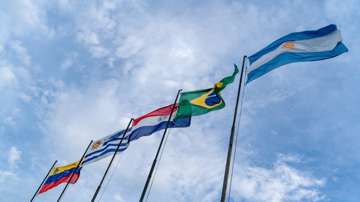Mercosur flags flying high. Several flagpoles with Mercosur flags. Latin American flags. South American flags.
