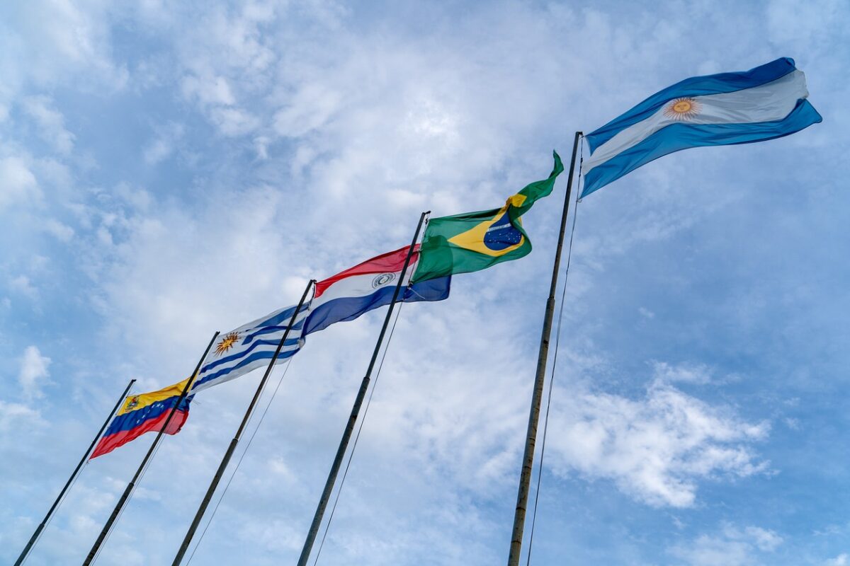 Mercosur flags flying high. Several flagpoles with Mercosur flags. Latin American flags. South American flags.