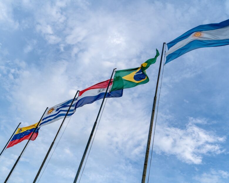 Mercosur flags flying high. Several flagpoles with Mercosur flags. Latin American flags. South American flags.