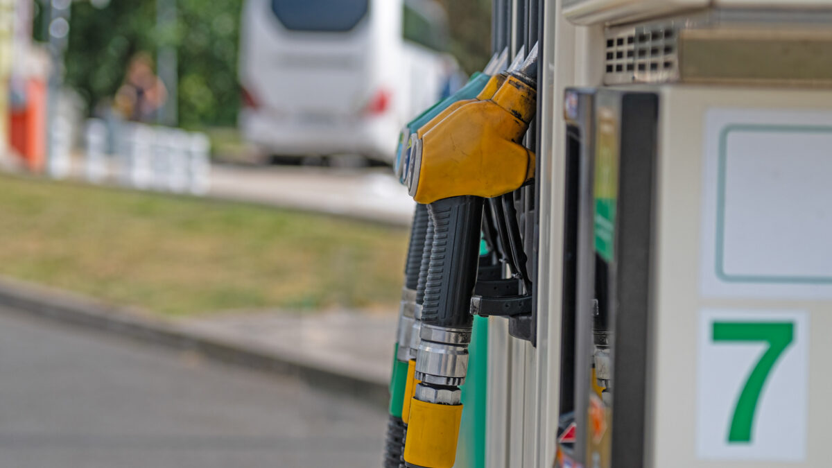 A fuel pump at a service station is ready for refueling.