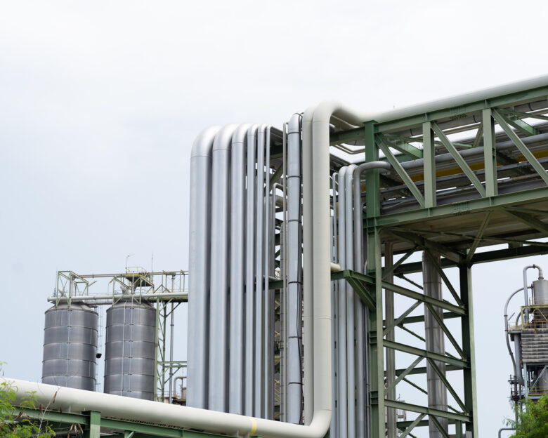 Gas interconnector. Pipeline for natural gas. Natural gas separation plant. Petroleum refinery piping network system. Network of pipes, valves, pumps, mechanisms deliver natural gas