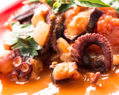 Stewed octopus in tomato sauce with parsley