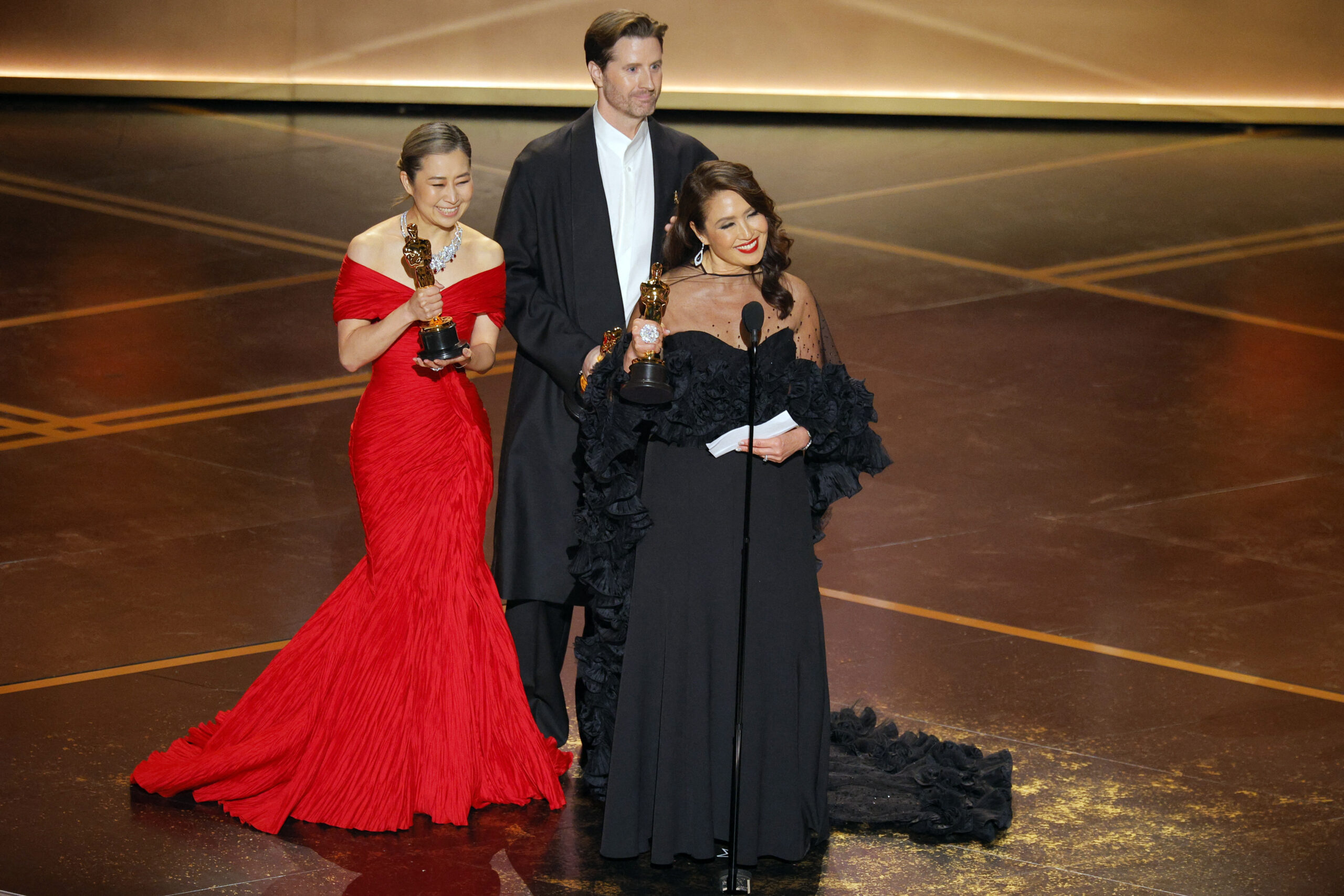 98th Academy Awards – Oscars Show – Hollywood Maggie Kang, Chris Appelhans and Michelle L.M. Wong win the Oscar for Best Animated Feature Film for