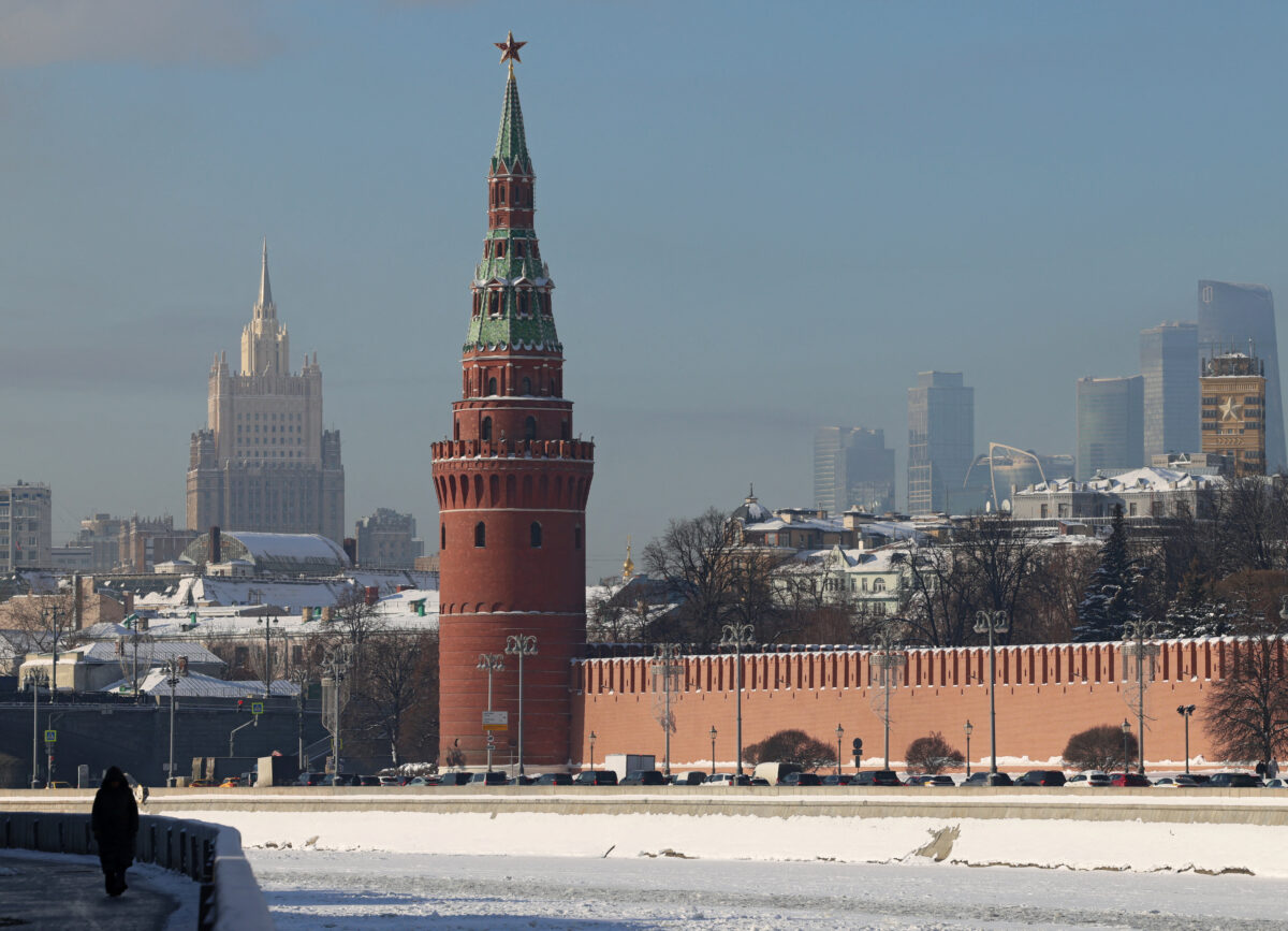 A person walks along an embankment of the Moskva River near the Kremlin wall in Moscow, Russia February 5, 2026. REUTERS/Anastasia Barashkova