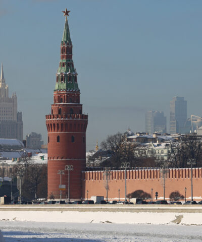 A person walks along an embankment of the Moskva River near the Kremlin wall in Moscow, Russia February 5, 2026. REUTERS/Anastasia Barashkova