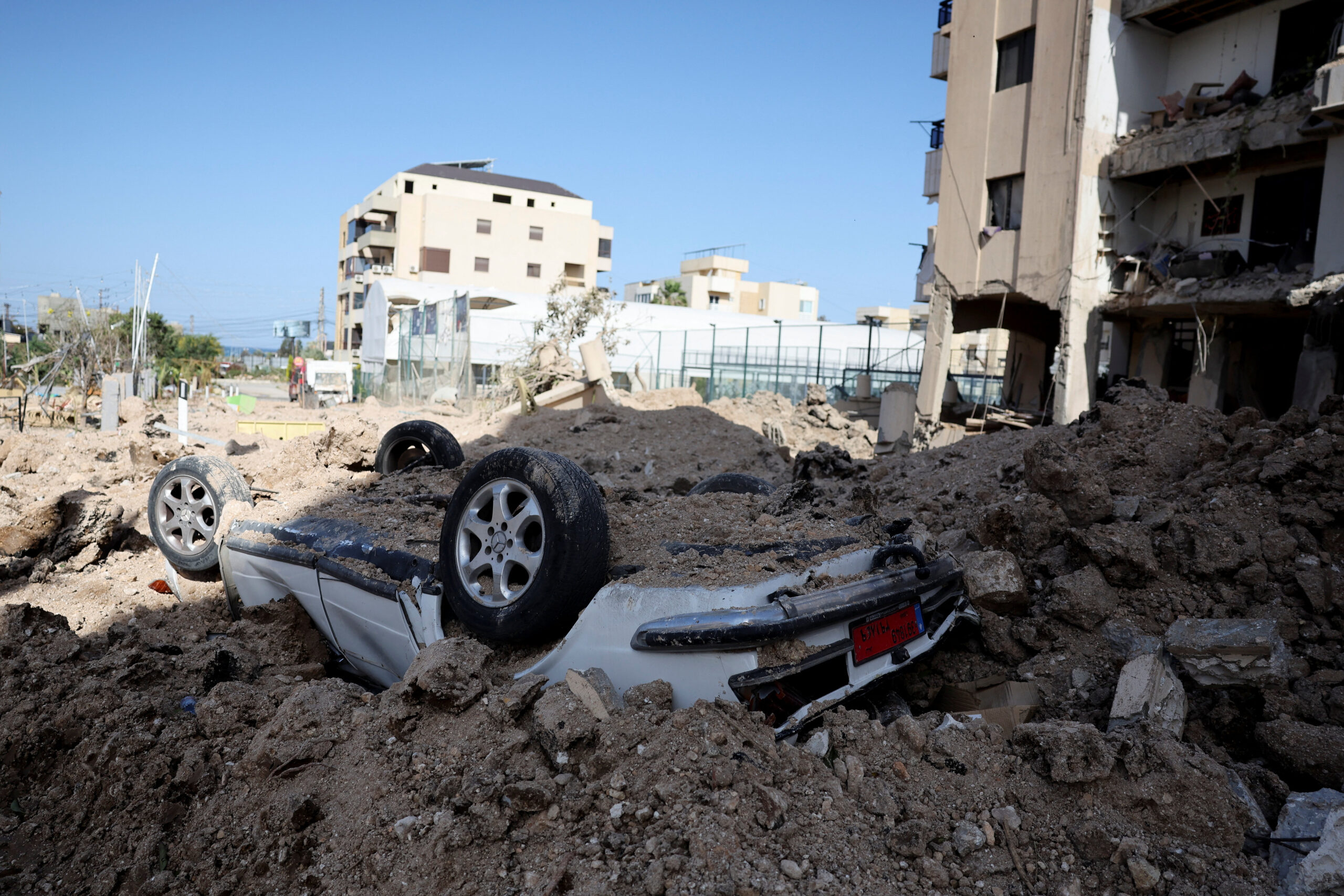 Aftermath of a strike, in Tyre A car lies under debris at the site of a strike on a building in Burj el-Shamali, following an escalation between Hezbollah and Israel amid the U.S.-Israeli conflict with Iran, in Tyre, Lebanon, March 18, 2026. REUTERS/Amr Abdallah Dalsh