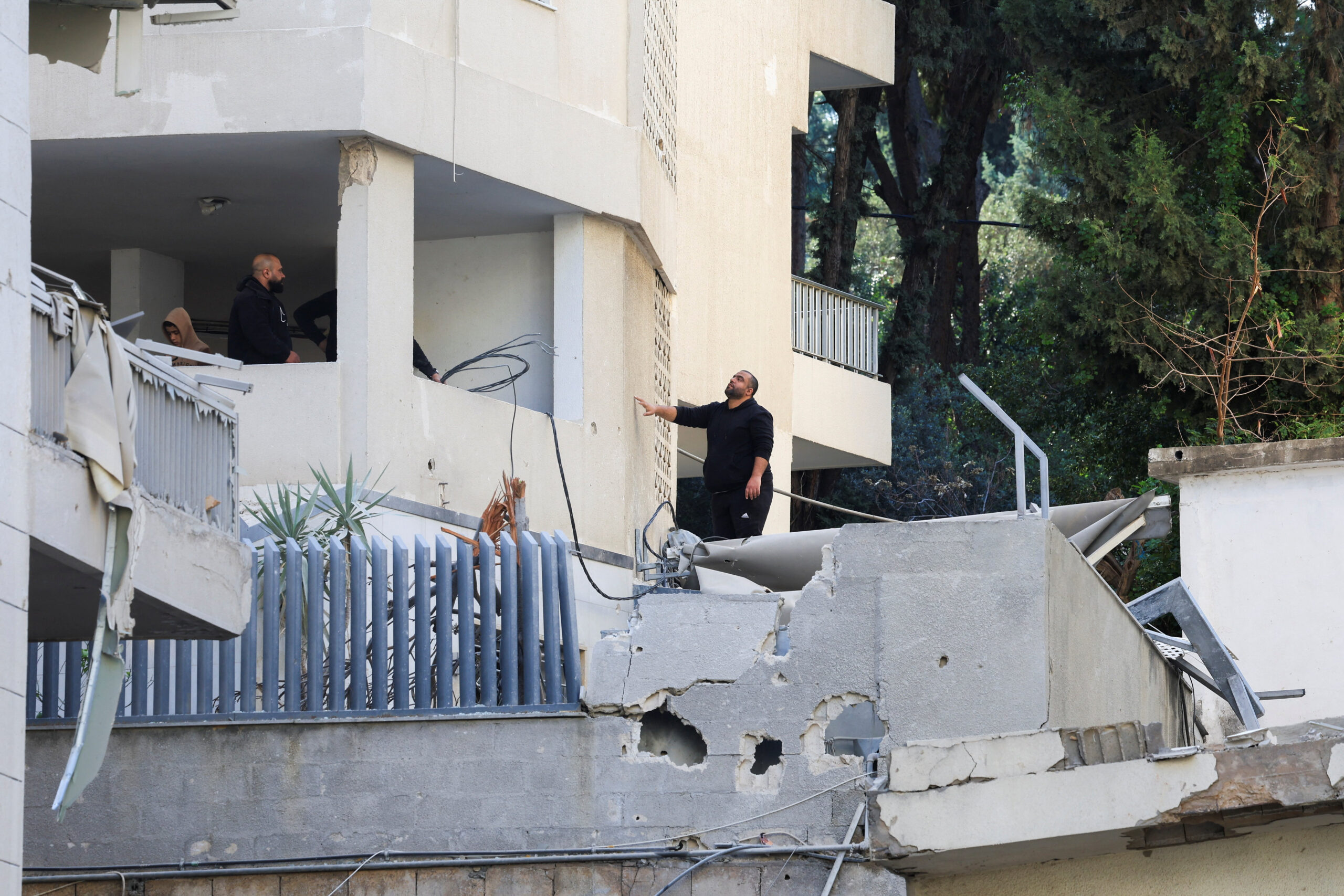 People inspect a damaged building in the aftermath of an Israeli strike, following an escalation between Hezbollah and Israel amid the U.S.-Israeli conflict with Iran, in Hazmieh, Lebanon, March 4, 2026. REUTERS