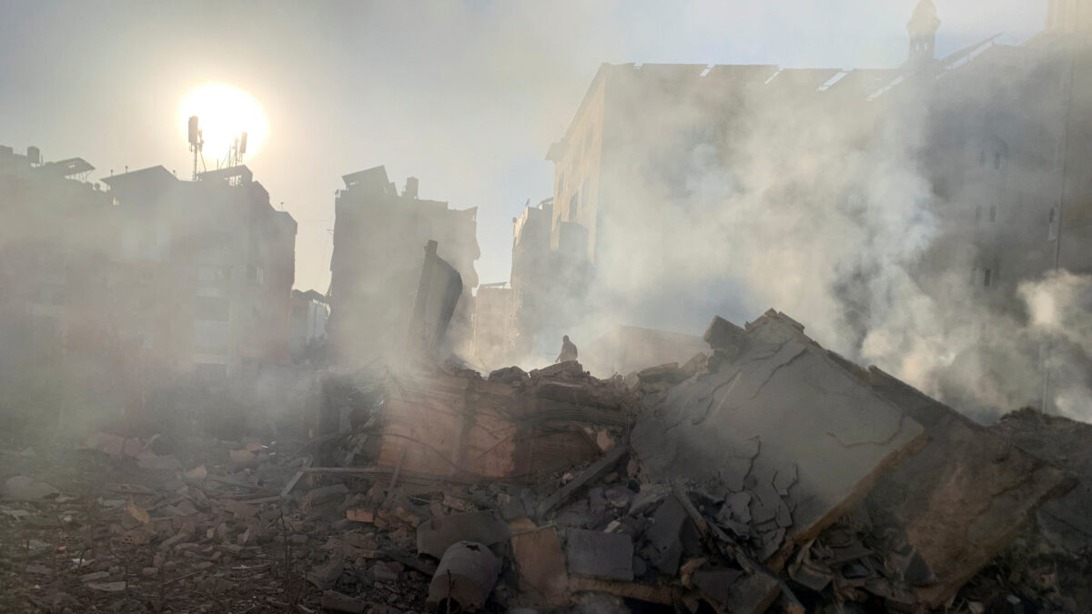 A member of the Lebanese Civil Defence inspects a destroyed building after a strike on Beirut's southern suburbs, following an escalation between Hezbollah and Israel, amid the U.S.-Israeli conflict with Iran, Lebanon, March 11, 2026. Picture taken with a mobile phone. REUTERS